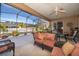 Relaxing screened patio with wicker furniture and outdoor views at 402 Turnstone Way, Orlando, FL 32828