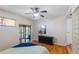 Light and airy bedroom with wood floors and access to a private balcony at 1000 Winderley Pl # 122, Maitland, FL 32751