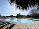 Community pool with lounge chairs and seating, all conveniently located near the lake at 1000 Winderley Pl # 122, Maitland, FL 32751