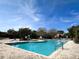 Community pool with lounge chairs and seating, all conveniently located for residents at 1000 Winderley Pl # 122, Maitland, FL 32751