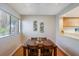 Bright dining area with wood table and hardwood floors at 1000 Winderley Pl # 122, Maitland, FL 32751