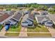 Aerial view of the house and neighborhood at 104 Sunny Oak Trl, Kissimmee, FL 34746