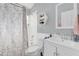 Clean bathroom with a floral shower curtain and white vanity at 104 Sunny Oak Trl, Kissimmee, FL 34746