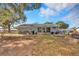 Home's backyard with screened porch and hammock at 10897 Sw 80Th Ct, Ocala, FL 34481