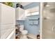 Small bathroom with shower, toilet, and white vanity at 10897 Sw 80Th Ct, Ocala, FL 34481