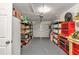 Garage with storage, workbench, and shelving units at 10897 Sw 80Th Ct, Ocala, FL 34481