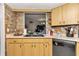 Kitchen with black appliances and wood cabinets at 10897 Sw 80Th Ct, Ocala, FL 34481