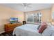 Serene bedroom features a window view, natural light, and a spacious layout for relaxation at 11753 Fan Tail Ln, Orlando, FL 32827