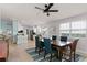 Bright dining area showcases an open layout, modern lighting, and views of the updated kitchen at 11753 Fan Tail Ln, Orlando, FL 32827