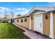 Welcoming front entrance with a paved walkway and white columns adding architectural detail at 11753 Fan Tail Ln, Orlando, FL 32827