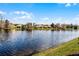 View of lake with lush green trees at 11753 Fan Tail Ln, Orlando, FL 32827