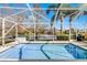 Screened in pool overlooking scenic lake at 11753 Fan Tail Ln, Orlando, FL 32827