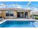 Relaxing screened pool with patio seating and open access to home interior at 11753 Fan Tail Ln, Orlando, FL 32827