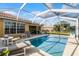 Backyard pool with deck chairs at 11753 Fan Tail Ln, Orlando, FL 32827