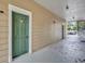 Exterior door with green paint to a unit in the condo at 13003 Plantation Park Cir # 1319, Orlando, FL 32821