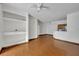 Living room with wood floors and view of the kitchen at 13003 Plantation Park Cir # 1319, Orlando, FL 32821