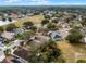 An aerial view showcases the property's location within a desirable neighborhood and wooded surroundings at 13713 Meadowpark Ave, Orlando, FL 32826