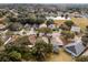 An aerial view showcases the property's location within a desirable neighborhood and wooded surroundings at 13713 Meadowpark Ave, Orlando, FL 32826