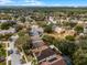 An aerial view showcases the property's location within a desirable neighborhood and wooded surroundings at 13713 Meadowpark Ave, Orlando, FL 32826