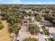 An elevated perspective shows rooftops nestled among trees in a quiet neighborhood, highlighting the community's peaceful setting at 13713 Meadowpark Ave, Orlando, FL 32826