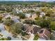 An aerial view showcases the property's location within a desirable neighborhood and wooded surroundings at 13713 Meadowpark Ave, Orlando, FL 32826