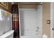 Bathtub and shower with tiled walls and fixtures at 13713 Meadowpark Ave, Orlando, FL 32826