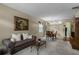 Cozy living room with neutral carpet, furniture, and an art piece at 13713 Meadowpark Ave, Orlando, FL 32826