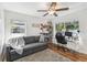 Comfortable bedroom featuring hardwood floors, a workspace, and natural light, perfect for a home office at 1412 Nebraska St, Orlando, FL 32803