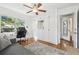 Cozy bedroom with built-in closets, desk space, hardwood floors, and natural light for a home office at 1412 Nebraska St, Orlando, FL 32803