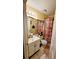 Cozy bathroom featuring a shower-tub combo, tiled floor and vanity at 1417 Brookebridge Dr, Orlando, FL 32825