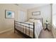 Bedroom with a bed, nightstand, and artwork at 14502 Bahama Swallow Blvd, Winter Garden, FL 34787