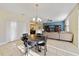 Casual dining area with table and chairs offering views of living room and kitchen at 14502 Bahama Swallow Blvd, Winter Garden, FL 34787