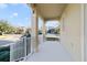 Covered front porch with white railings and a view of the street at 14502 Bahama Swallow Blvd, Winter Garden, FL 34787