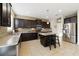 Well-equipped kitchen featuring granite countertops and dark wood cabinets at 14502 Bahama Swallow Blvd, Winter Garden, FL 34787