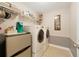 Laundry room with washer, dryer, and shelving at 14502 Bahama Swallow Blvd, Winter Garden, FL 34787