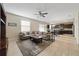 Open living room showcasing a spacious layout, neutral color palette, and ample natural light at 14502 Bahama Swallow Blvd, Winter Garden, FL 34787