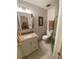 Bathroom showcasing a marble floor and a sink with a granite countertop at 1500 Gay Rd # 10C, Winter Park, FL 32789