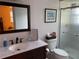 Bathroom features a marble vanity top and updated fixtures, with a glass-enclosed shower at 1500 Gay Rd # 10C, Winter Park, FL 32789