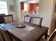 Dining room view into the kitchen area with warm colors and natural light at 1500 Gay Rd # 10C, Winter Park, FL 32789