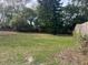 Spacious backyard with mature trees and a chain link fence at 158 Country Club Cir, Sanford, FL 32771