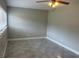 Bright bedroom featuring tiled floor, neutral walls, and a window with blinds for natural light at 158 Country Club Cir, Sanford, FL 32771