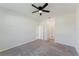 Comfortable bedroom with carpet and a ceiling fan at 16462 Glassy Loch Loop, Clermont, FL 34714