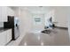 Kitchen featuring stainless steel appliances, grey countertops and white cabinets at 16462 Glassy Loch Loop, Clermont, FL 34714