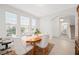 Bright dining area featuring hardwood floors, a decorative rug, and an archway to the rest of the home at 16560 Point Rock Dr, Winter Garden, FL 34787