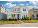 Charming two-story home with a well-maintained lawn and a welcoming purple front door at 16560 Point Rock Dr, Winter Garden, FL 34787