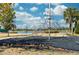 Neighborhood playground with a jungle gym. A lake is visible in the background at 16560 Point Rock Dr, Winter Garden, FL 34787