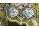 Aerial view of community amenities, including pools, playground, and open space at 1830 Sawyer Palm Pl, Kissimmee, FL 34747