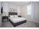 Bedroom with a full-size bed and simple decor at 1830 Sawyer Palm Pl, Kissimmee, FL 34747