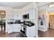 Kitchen with white cabinets, stainless steel appliances, and granite countertops at 1834 Duffy Ct, Lake Mary, FL 32746