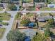 Aerial view featuring home with fenced yard, picnic shelter, and mature trees at 1971 Urbana Ave, Deltona, FL 32725